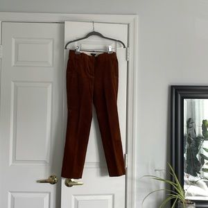 boot cut cropped pants. Rust brown, zipper front pockets . Very good condition